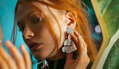 Gill Clement Jewellery model with earrings