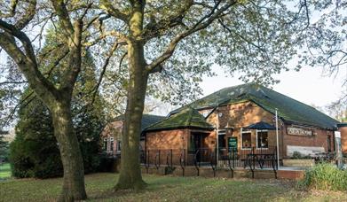 Pub On The Pond entrance and trees