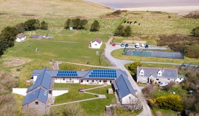 St Madoc Centre aeiral photo with bay in the background