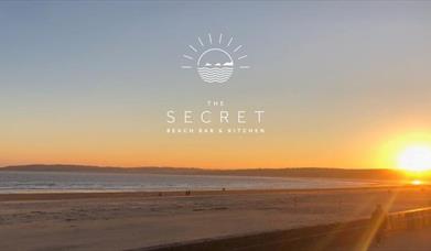 The Secret Beach Bar view and logo