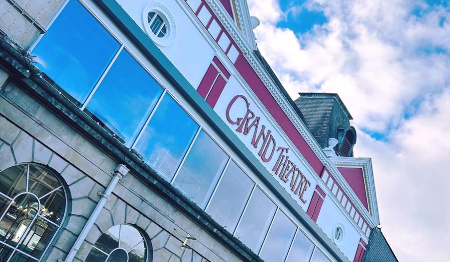 Swansea Grand Theatre exterior, an old building with painted red detailing.