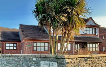 Llun o un o'r ddau lety sydd ar gael gan Gower Coast Holiday Homes. 1 Greenacres, Pen-clawdd yw hwn.