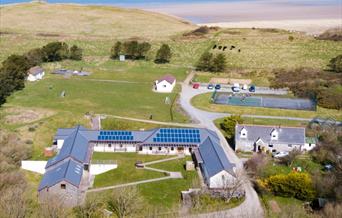 St Madoc Centre aeiral photo with bay in the background