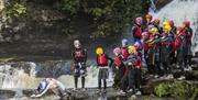 Adventure Britain people diving into water