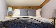 A double bed room available in one of the Gower Country Cottages