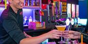 Bartender serving a drink at Bunkers