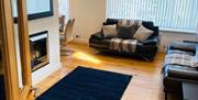 The living room inside one of the Gower Coast Holiday Homes.