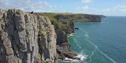 An abseiling session taking place in Gower facilitated by Gower Activities Centre