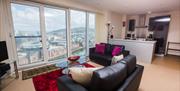 Baystays sofa and living room looking out over marina