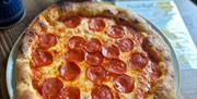 Bluebell Coffee and Kitchen pepperoni pizza with drinks