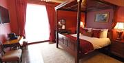 Four poster bed and elegant furnishings in a grand Georgian bedroom