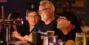 Cu Mumbles customers at bar
