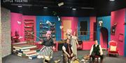 Dylan Thomas Theatre cast acting on stage