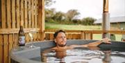 Hillside Glamping man in hot tub