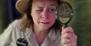 Jungle Escape at Plantasia explorer with magnifying glass