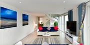 Meridian Quay Apartments living area with sofa and spiral staircase