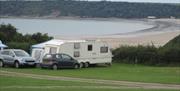 Nicholaston Farm caravans parked with view of bay