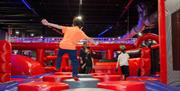 Ninja Warrior children climbing on pedastals
