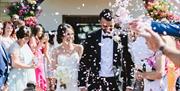Oldwalls Gower married couple getting showered with confetti