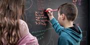 Oriel Science children writing on interactive wall