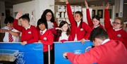 Oriel Science school class touring exhibits