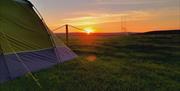 Panoramic Camping and Glamping tents with sunset