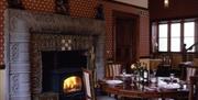 Parc-Le-Breos Restaurant dining table by fireplace