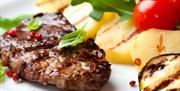 Parc-Le-Breos Restaurant steak and vegetables
