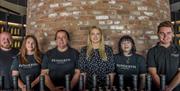Penderyn Swansea Copperworks Distillery staff wearing branded tshirts