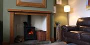 Pitton Cross Farm living area with sofa and fireplace