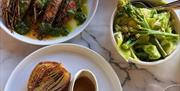 Rok Mumbles seafood dishes with sauce and fires