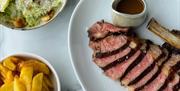 Rok Mumbles sliced steak with salad and chips