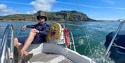 Skipper Dai taking it easy on the beautiful Gowert coast