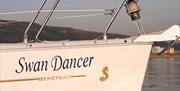 The yacht Swan Dancer sailing in Swansea Bay