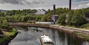 Swansea Community Boat sailing past copperworks