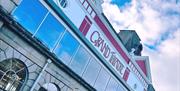 Swansea Grand Theatre exterior, an old building with painted red detailing.