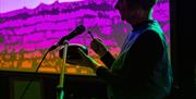 Tŷ Tawe musician on stage