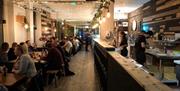 The Pizza Boys interior with customers eating pizzas