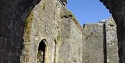 Weobley Castle interior through archway