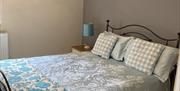 A double bed room available in one of the Gower Country Cottages