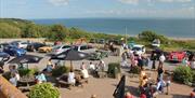 A number of people enjoying the outdoor seating at Bank Farm Leisure Park